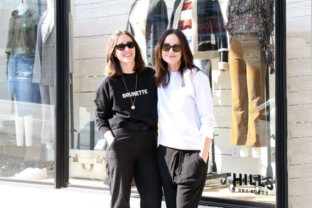 Katrina and Caroline photographed wearing sweatshirts from Brunette the Label outside the Hills of Kerrisdale store in Vancouver, BC.